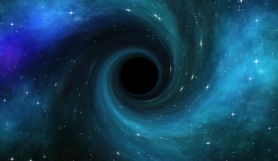 black hole in deep space pulling in starlight