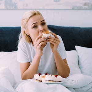 Woman is emotional and comfort eating