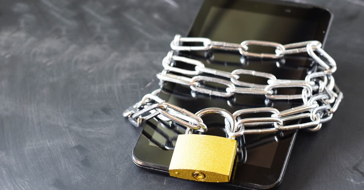 Smartphone in chain and padlock