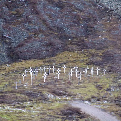the white crosses of the historic graveyard cemetery, built in 1918 after miners died of the Spanish flu, in Longyearbyen, Spitsbergen, Svalbard, Norway