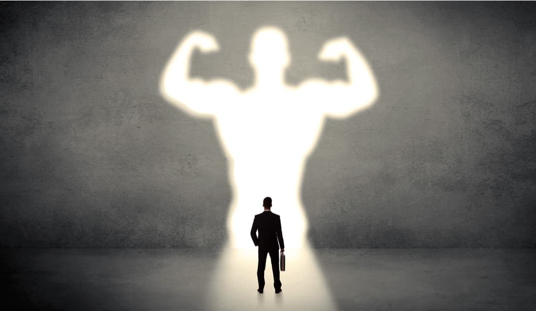 man standing and seeing himself better by the power of intention