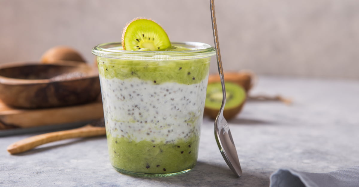 Chia pudding in a glass with fresh kiwi.