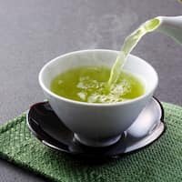 Pouring a cup of green tea