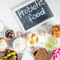 Super healthy probiotic fermented food and drinks on white marble background