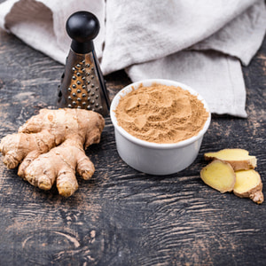 Ginger roots and powder. Natural healthy ingredient