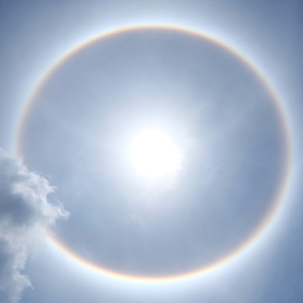 Fantastic beautiful sun halo phenomenon in Thailand,or the sun with a circular rainbow.