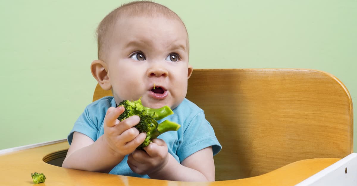 Funny baby tries and doesn't like broccoli