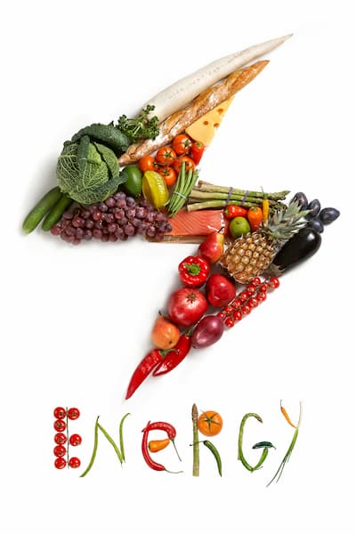 Energy diet, food symbol represented by foods in the shape of flash to show the health concept of eating well with fruits and vegetables