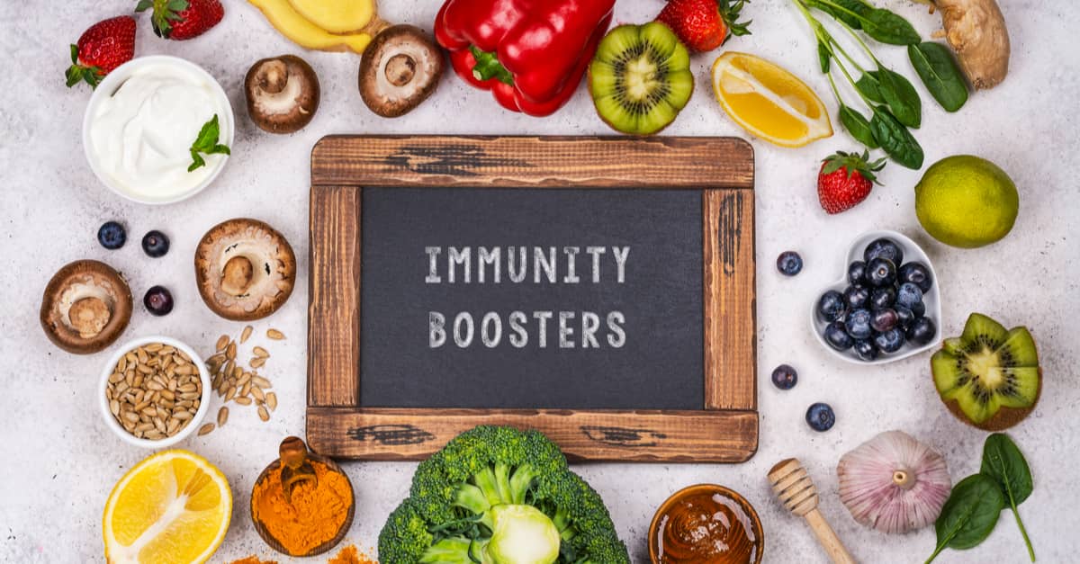 board saying immunityboosters surrounded by nutritious foods