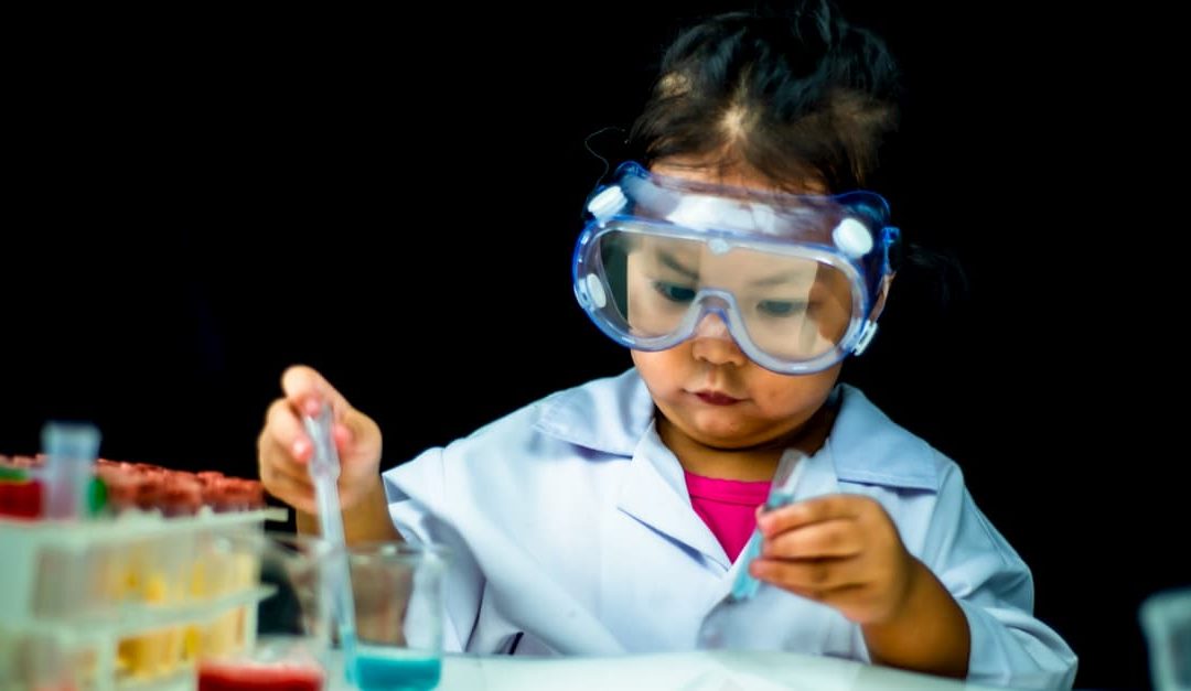 A little girl practising science skills for preschoolers.