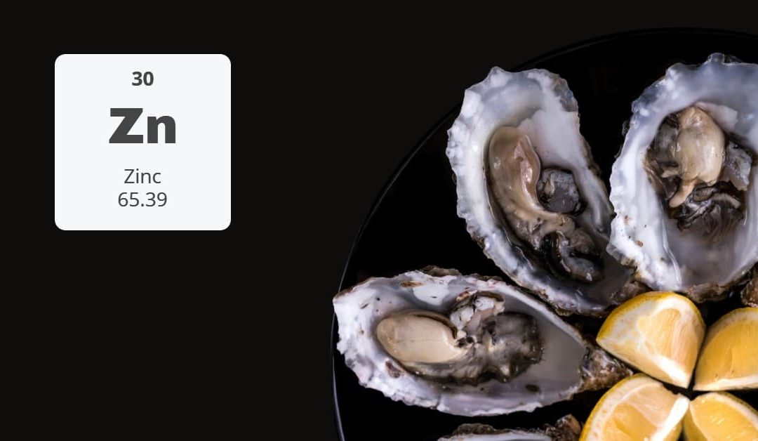 Zinc Benefits: Fresh oysters and lemon slices, a rich source of zinc