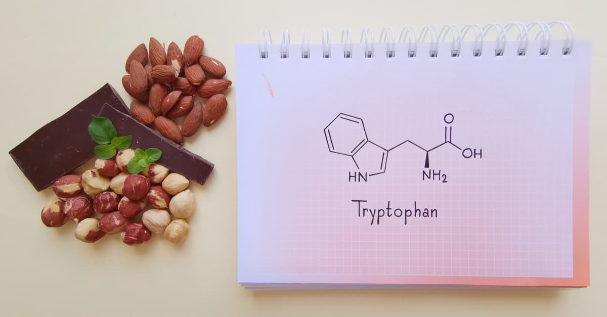 Structural chemical formula of tryptophan amino acid molecule with foods containing tryptophan, which is needed to produce serotonin