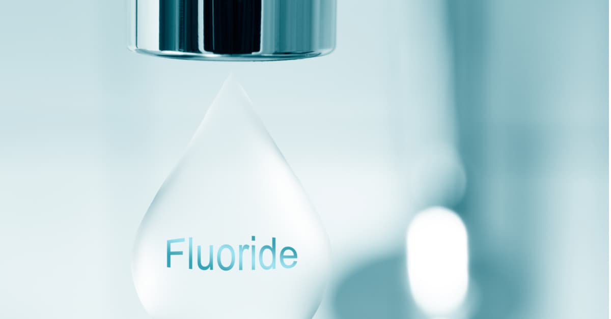 Fluoride added to drinking water to prevent tooth decay.