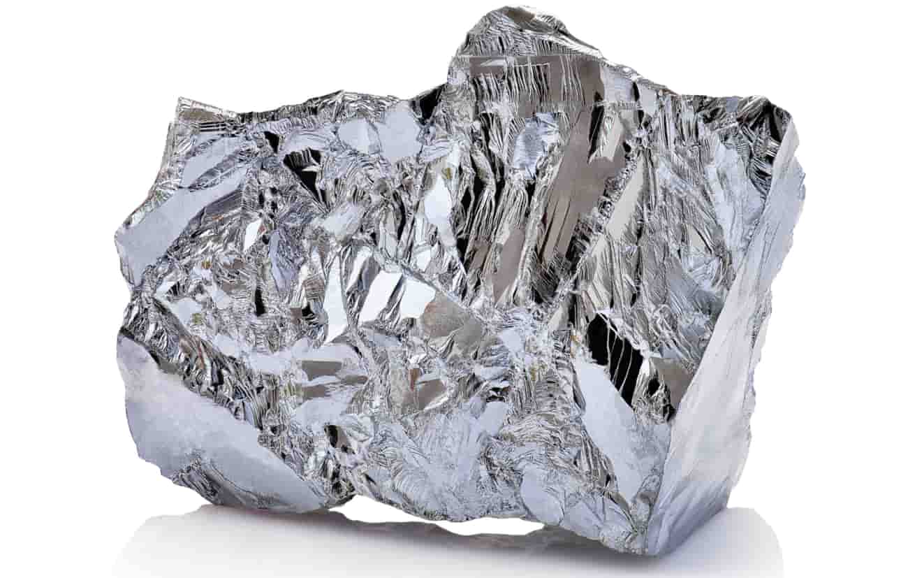 Macro shot of a piece of nickel metal ore isolated on a white background