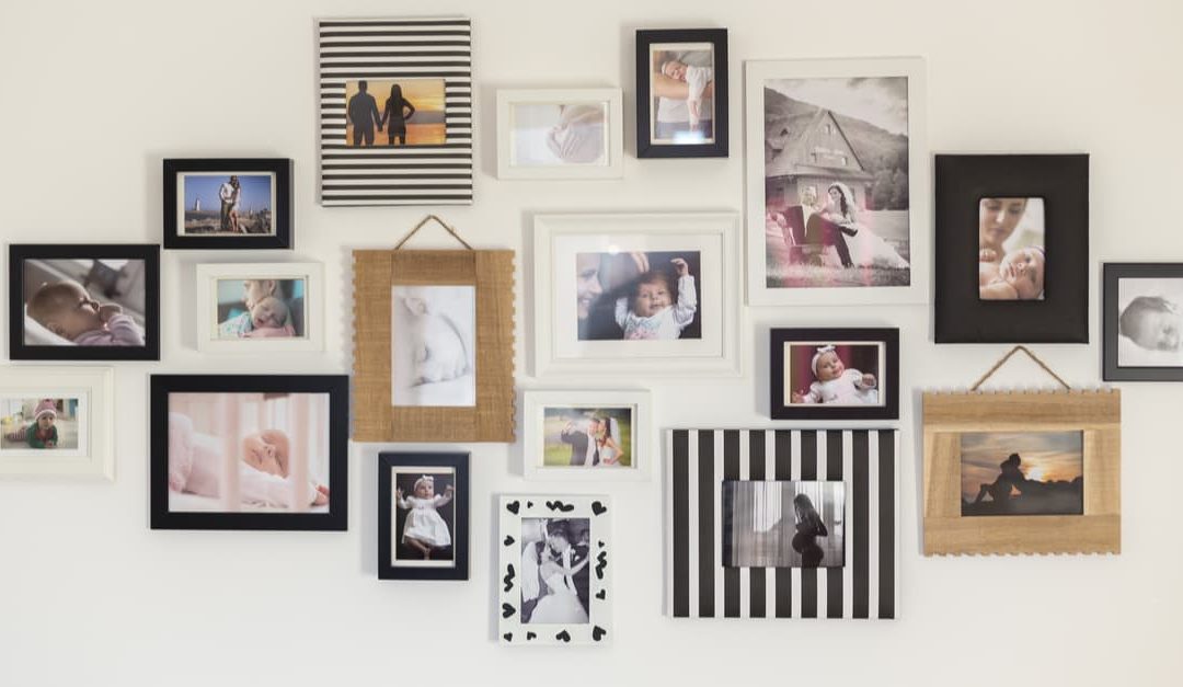 Collection of family photographs on a white wall