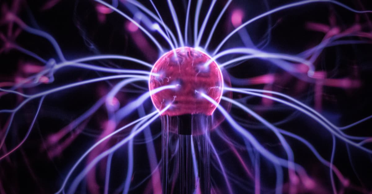 Purple plasma ball with light energy stemming from its centre