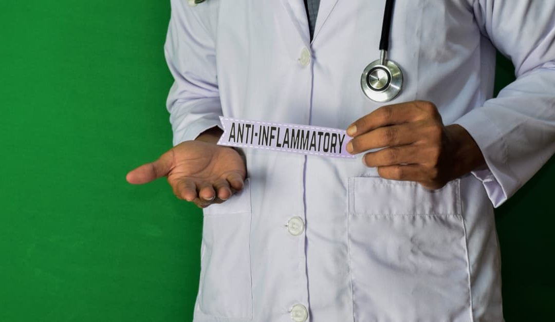 Doctor holding an anti-inflammatory label