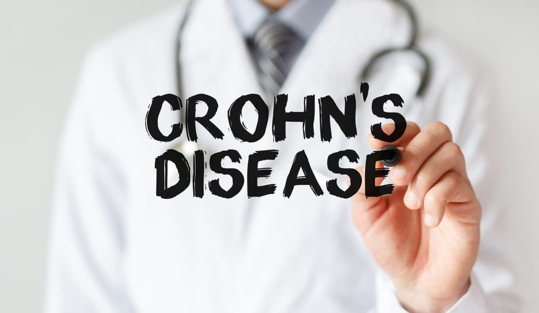 Doctor writing the words Crohn's Disease with a marker
